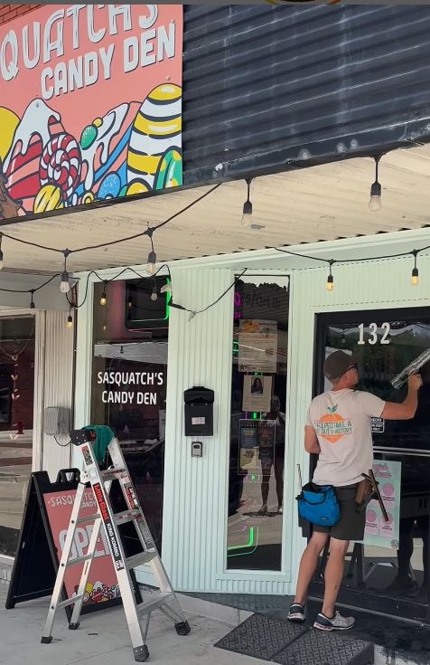 Window cleaning in Parker County Texas.  Window Wranglers cleans a storefront window set in downtown Weatherford